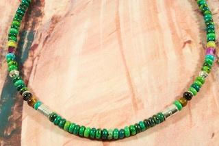 Genuine Turquoise Necklace with Blue Lapis, Black Onyx, Sugilite and Tiger's Eye Accents. Sterling Silver Barrels, Beads and Clasp. Created by Navajo Artist Tommy Singer. Signed.